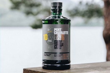 A image of a bottle of Port Charlotte 10 Year Old on a a park bench. Port Charlotte 10 is one of our Whisky Wednesday deals.